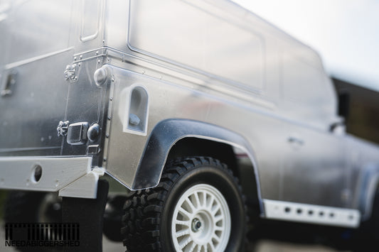 Defender door handles and fuel cap.