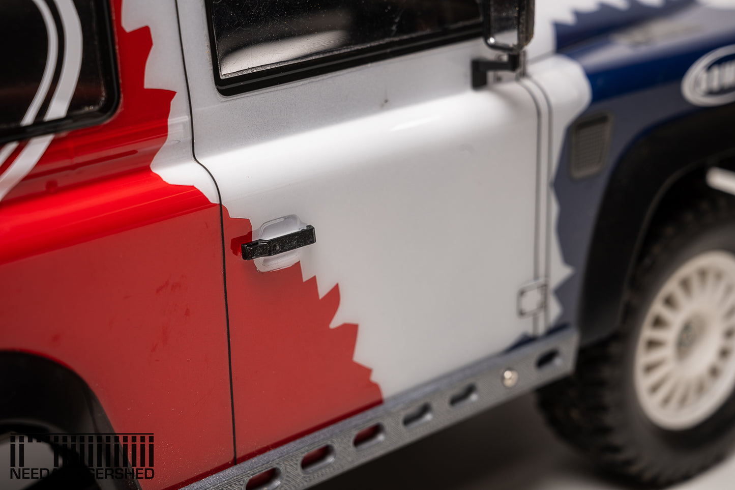 Defender door handles and fuel cap.