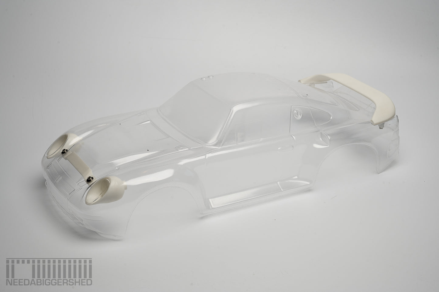 959 Solid resin Rear wing and front light buckets.