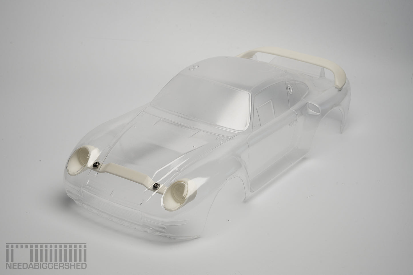 959 Solid resin Rear wing and front light buckets.